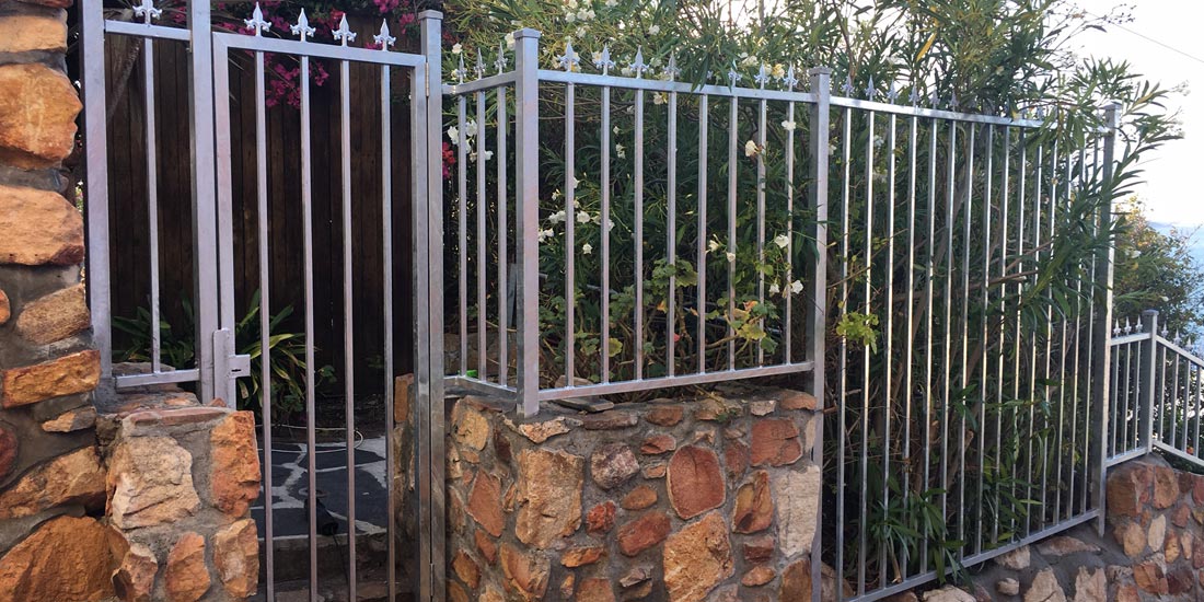 Galvanised steel pedestrian gate with fencing
