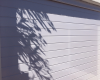 White horizontal slatted aluminium sectional door