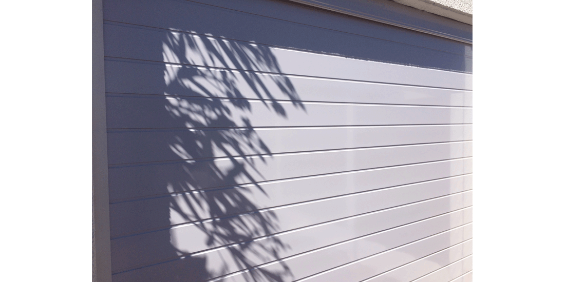 White horizontal slatted aluminium sectional door