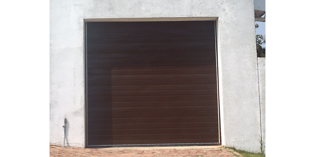 Single brown horizontal slatted fibreglass tip up door
