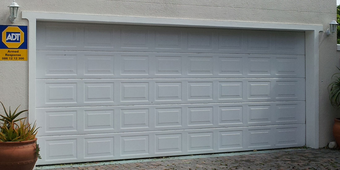 Double white raised and fielded aluzinc sectional door